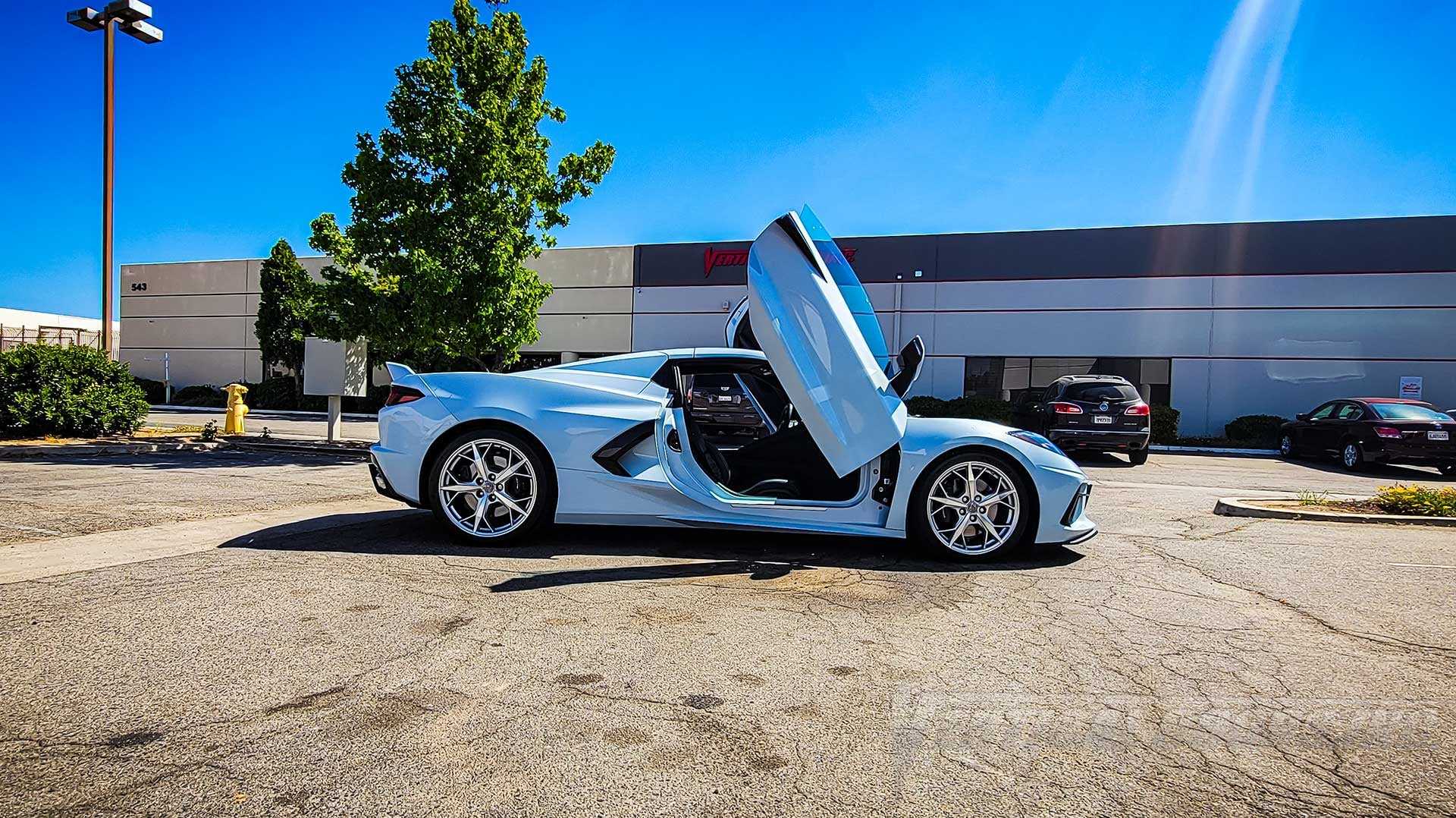 Lambo Doors Kit installed on a Chevrolet Corvette C8 by Vertical Doors, Inc. in California.