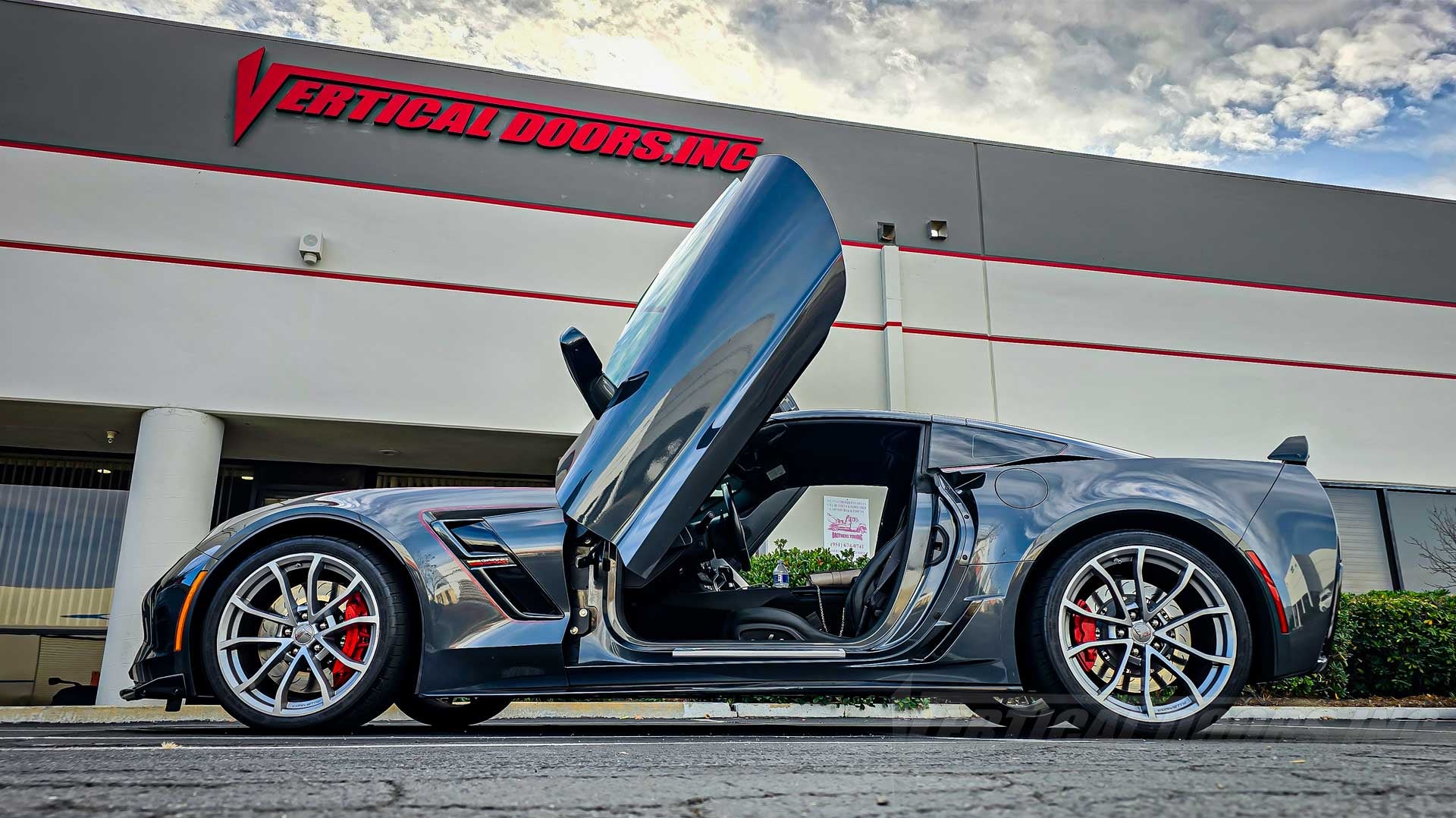 Nom’s Chevrolet Corvette C7 Grand Sport just got an authentic Vertical Lambo Door Kit installed by Vertical Doors, Inc. in Lake Elsinore, California!