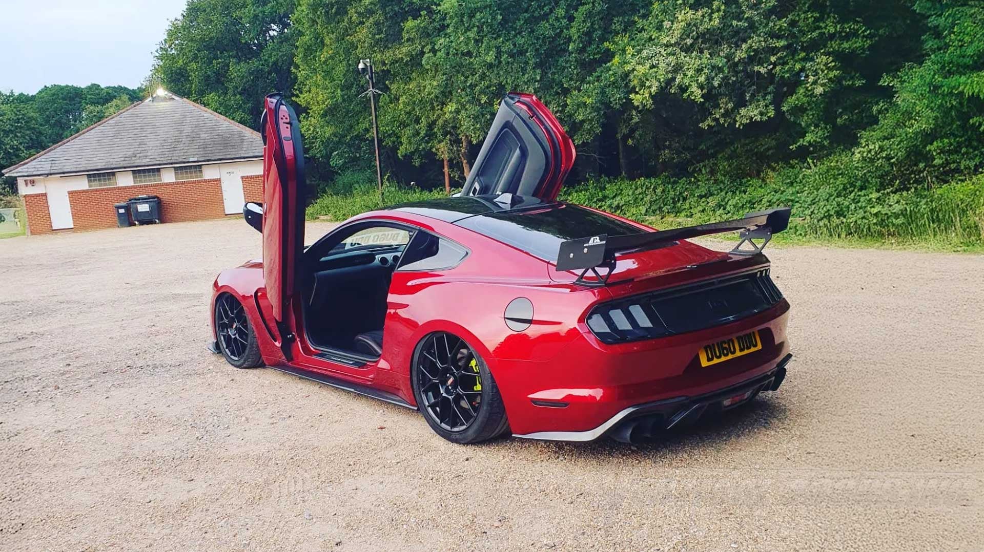 Installer | Shark Car Design LTD| Chiddingfold, Godalming GU8 5SZ, UK | Ford Mustang featuring Vertical Doors, Inc. lambo door conversion kit.