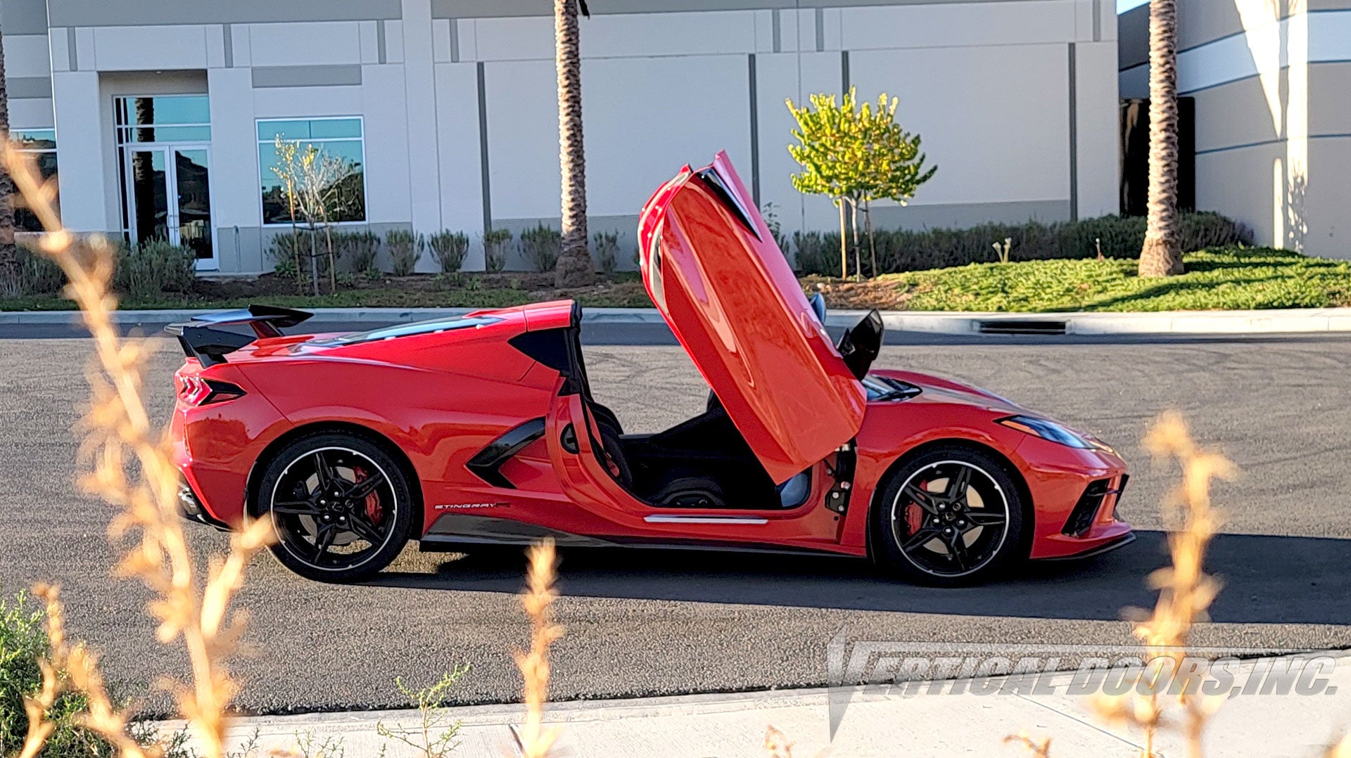 Chevrolet Corvette C8 featuring Vertical Doors, Inc., vertical lambo door conversion kit.