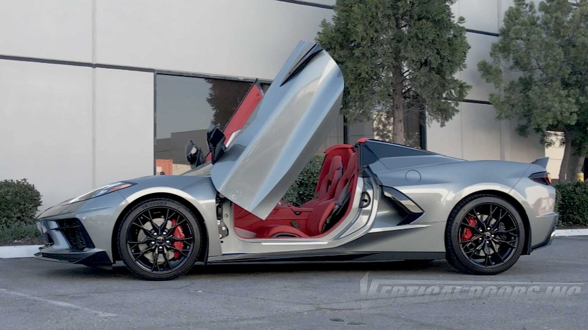Silver Chevrolet Corvette C8 featuring Door conversion kit by Vertical Doors, Inc. AKA "Lambo Doors"