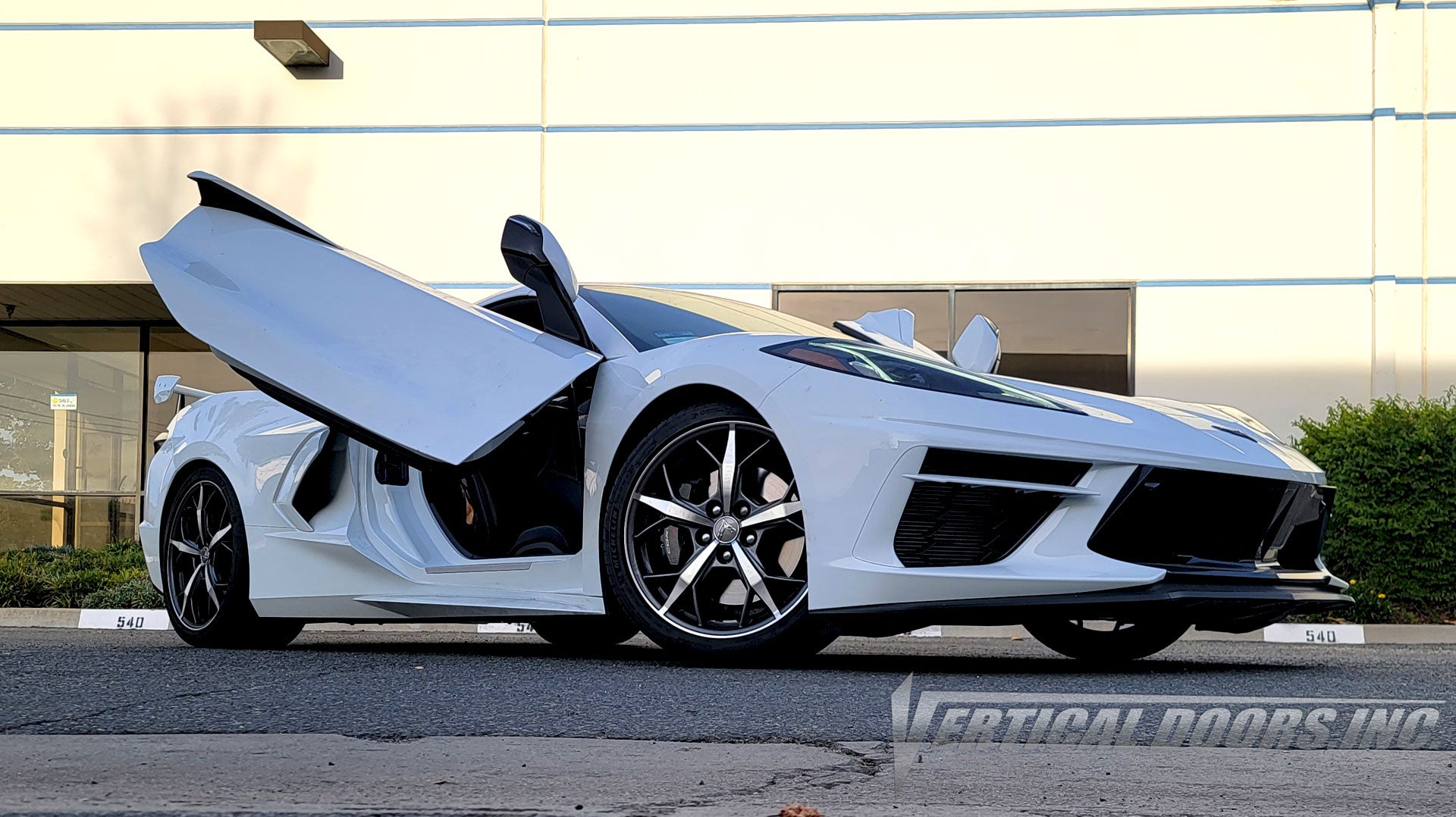 Arctic White Chevrolet Corvette C8 from California featuring ZLR Door conversion kit by Vertical Doors, Inc.