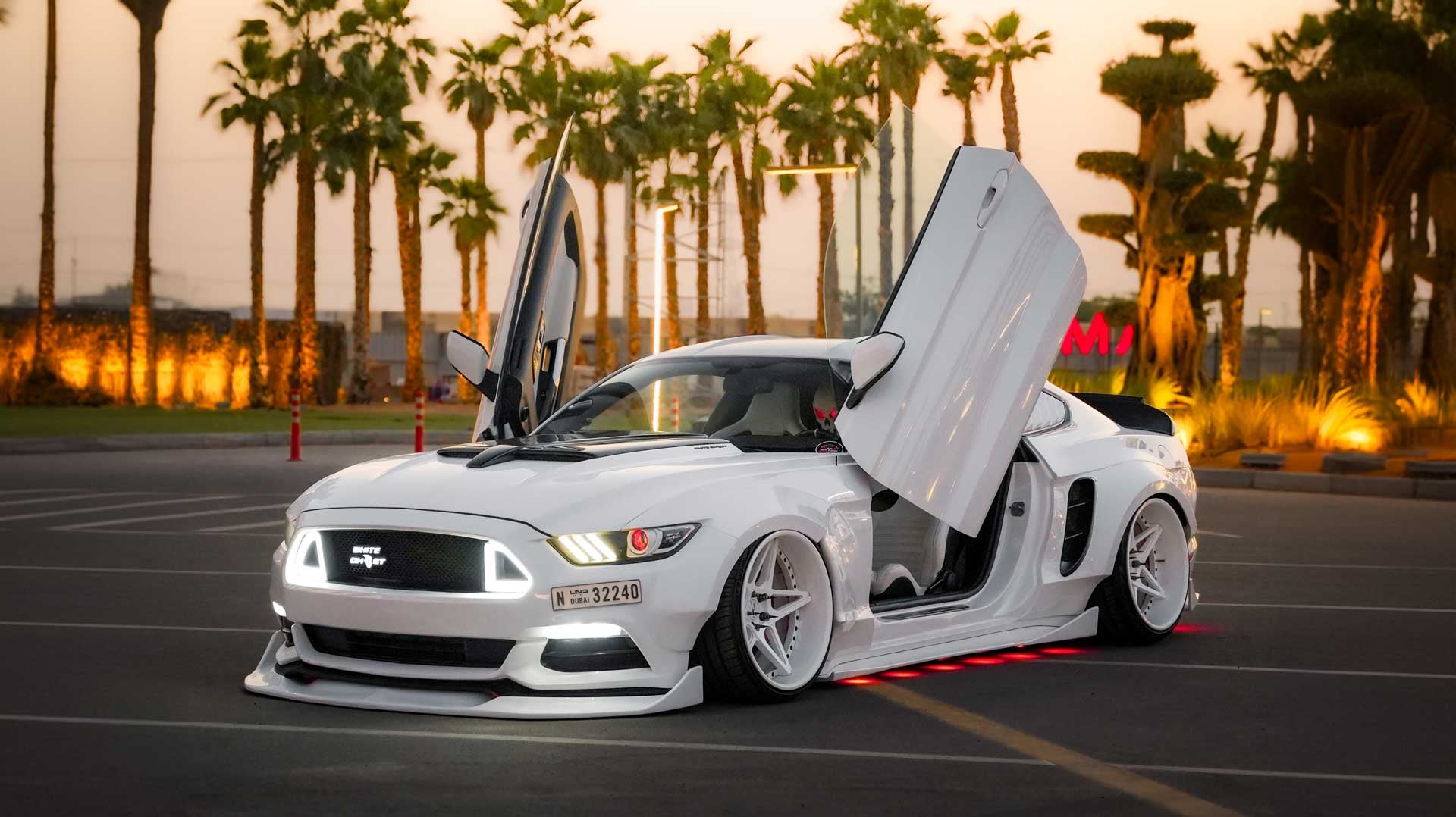 Bakri's Ford Mustang @white.ghost.3224 "White Ghost" from Dubai, United Arab Emirates featuring Lambo Doors Conversion kit from Vertical Doors, Inc.