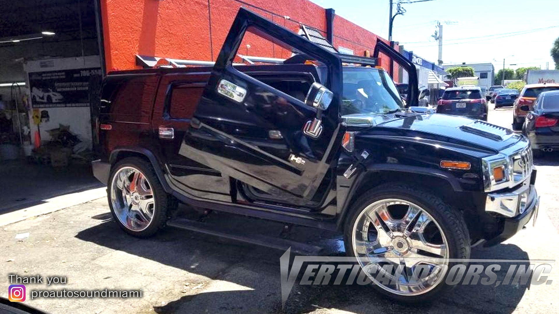 Installer | Pro Auto Sound Miami | Miami, FL | Hummer H2 featuring Verical Doors, Inc. vertical lambo door conversion kit.