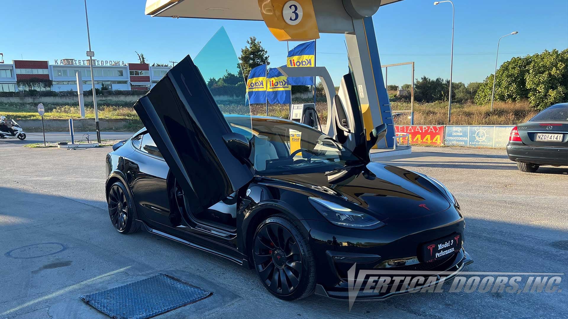 Tesla Model 3 from Thessaloniki, Greece featuring Vertical Door conversion kit by Vertical Doors, Inc. AKA "Lambo Doors"