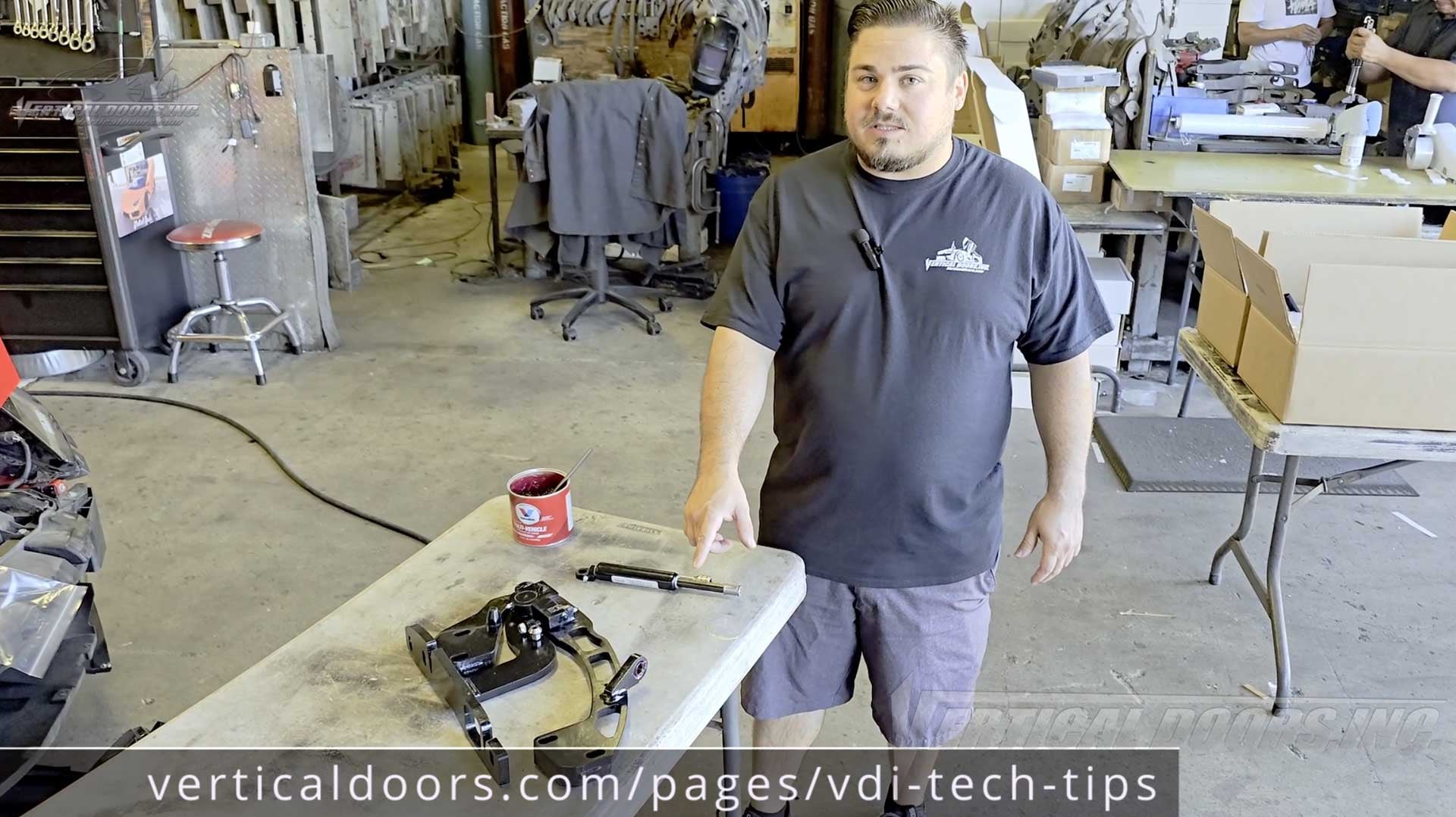 Tech Tip, how to install the Vertical Doors, Inc. shock. Greasing the Spherical Ball Bearing.