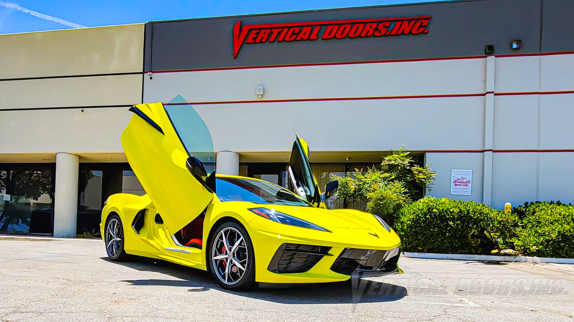 PhotoQuest Studio’s Accelerate Yellow C8 Corvette with Lambo Doors Kit installed by Vertical Doors, Inc.
