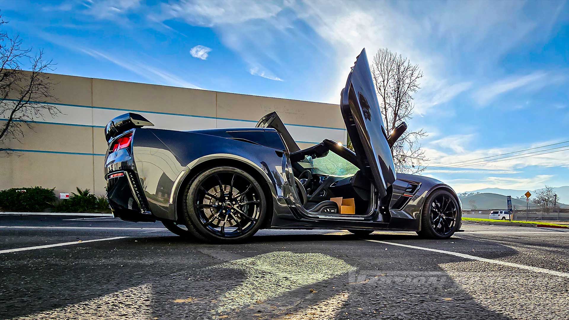 Vertical Lambo Door Kit installed on a Chevrolet Corvette C7 Grand Sport from Washington, kit installed and manufactured by Vertical Doors, Inc.