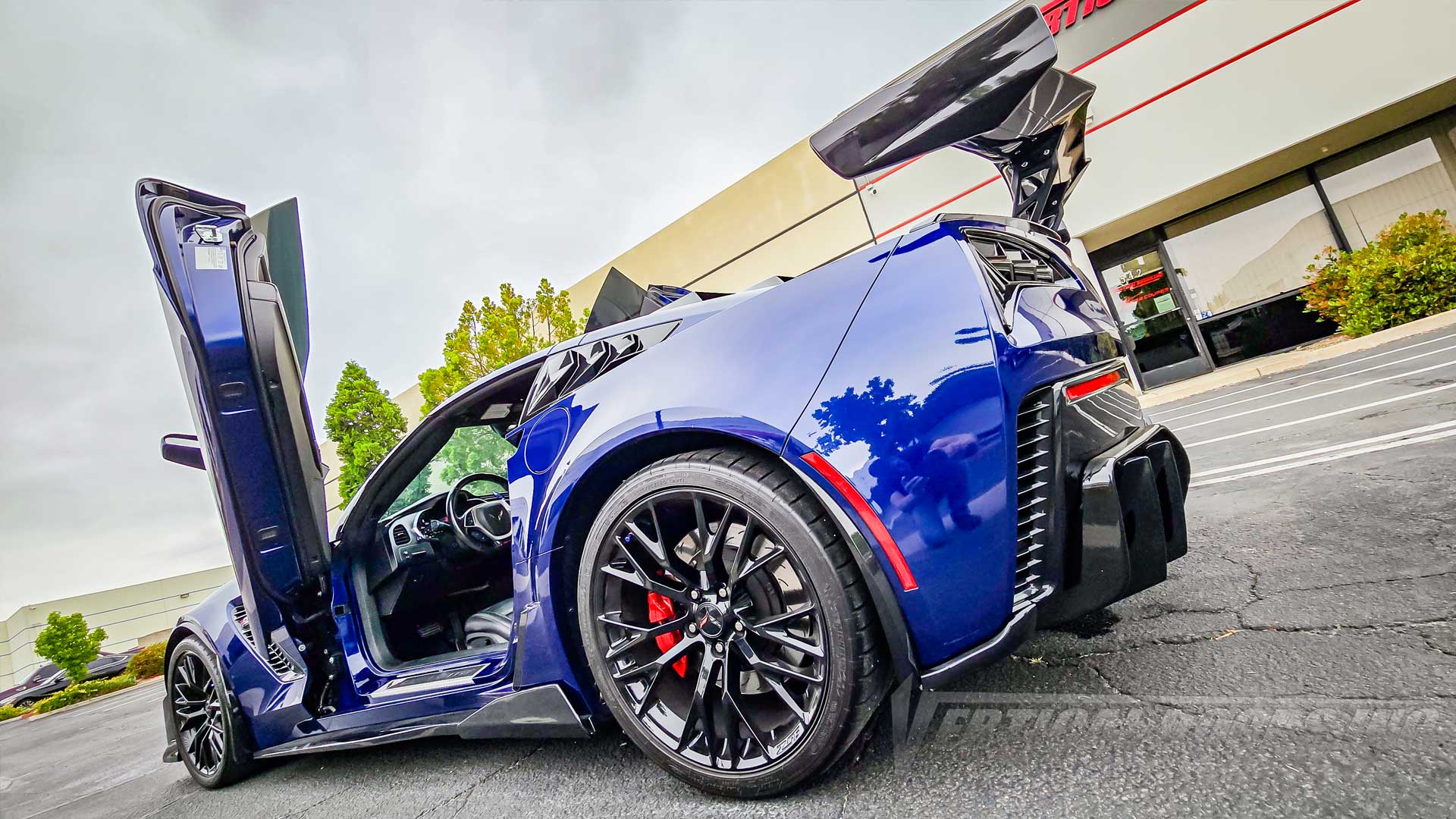Erik’s Admiral Blue Chevrolet Corvette C7 Z06 from California with lambo door conversion kit by Vertical Doors, Inc. 