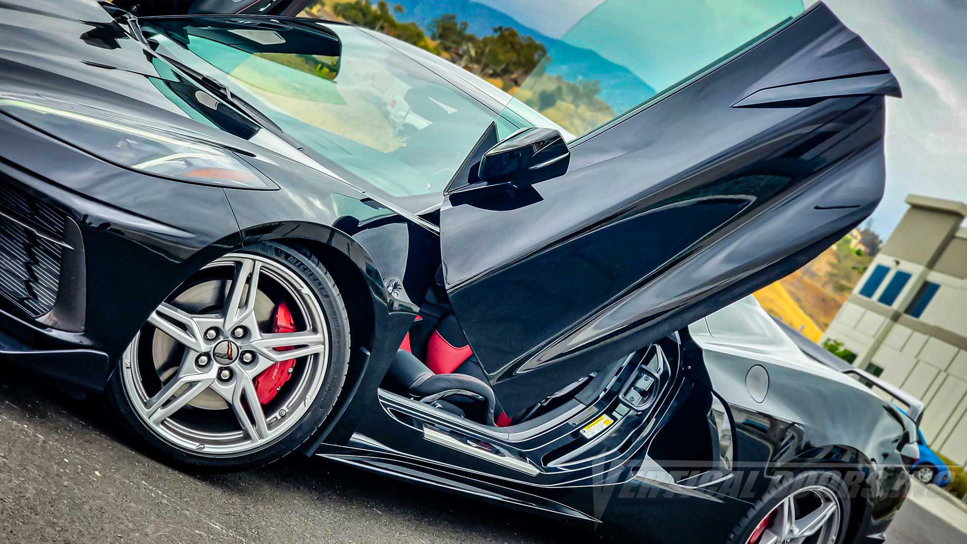 Black C8 Corvette with Lambo Doors Kit installed by Vertical Doors, Inc.