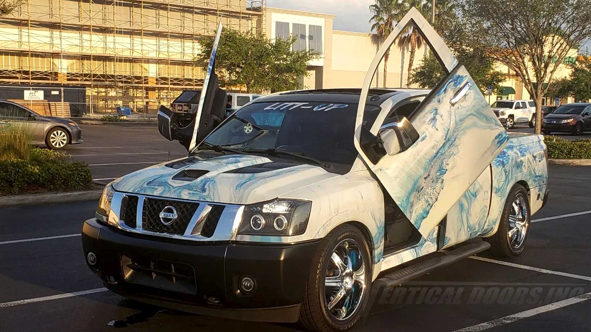 @Aquadrip50 Nissan Titan truck from Atlanta with Vertical Lambo Door kit by Vertical Doors, Inc.