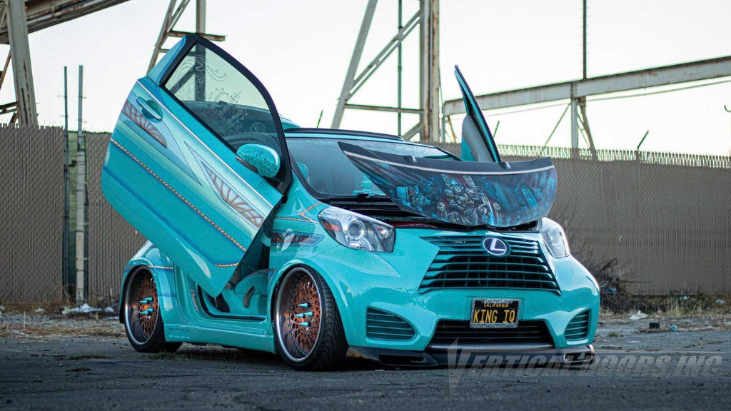 Joe’s @kingiq Scion IQ from California featuring lamb door conversion kit from Vertical Doors, Inc., a metal widebody kit and a ton of other upgrades.