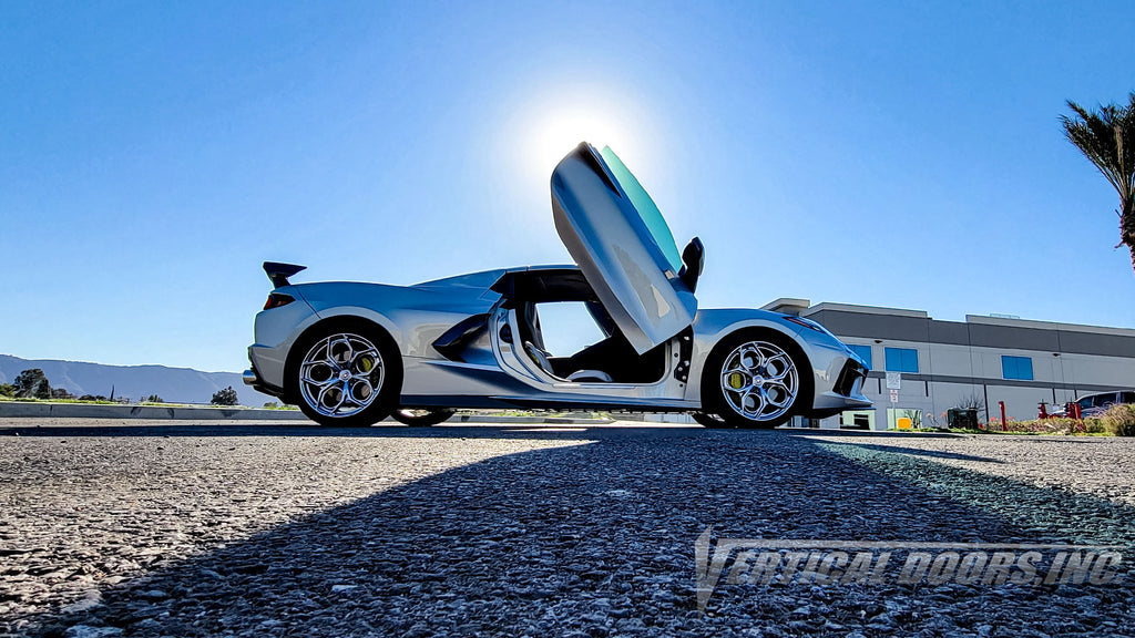 Silver Flare Chevrolet Corvette C8 from California featuring vertical lambo door conversion kit by Vertical Doors, Inc.