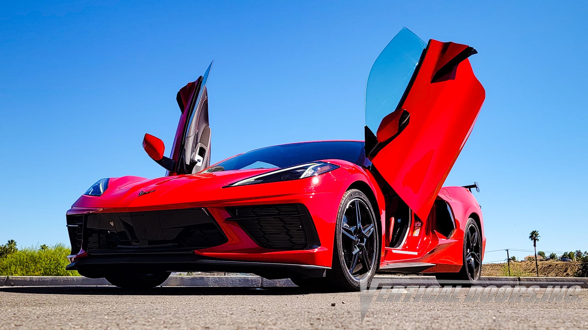 Red Corvette C8 featuring Vertical Door conversion kit by Vertical Doors, Inc. AKA "Lambo Doors"