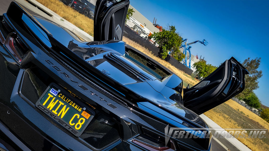 Black Chevrolet Corvette C8 3LT Convertible from California featuring Vertical Doors, Inc. door conversion kit. AKA "Lambo Doors"