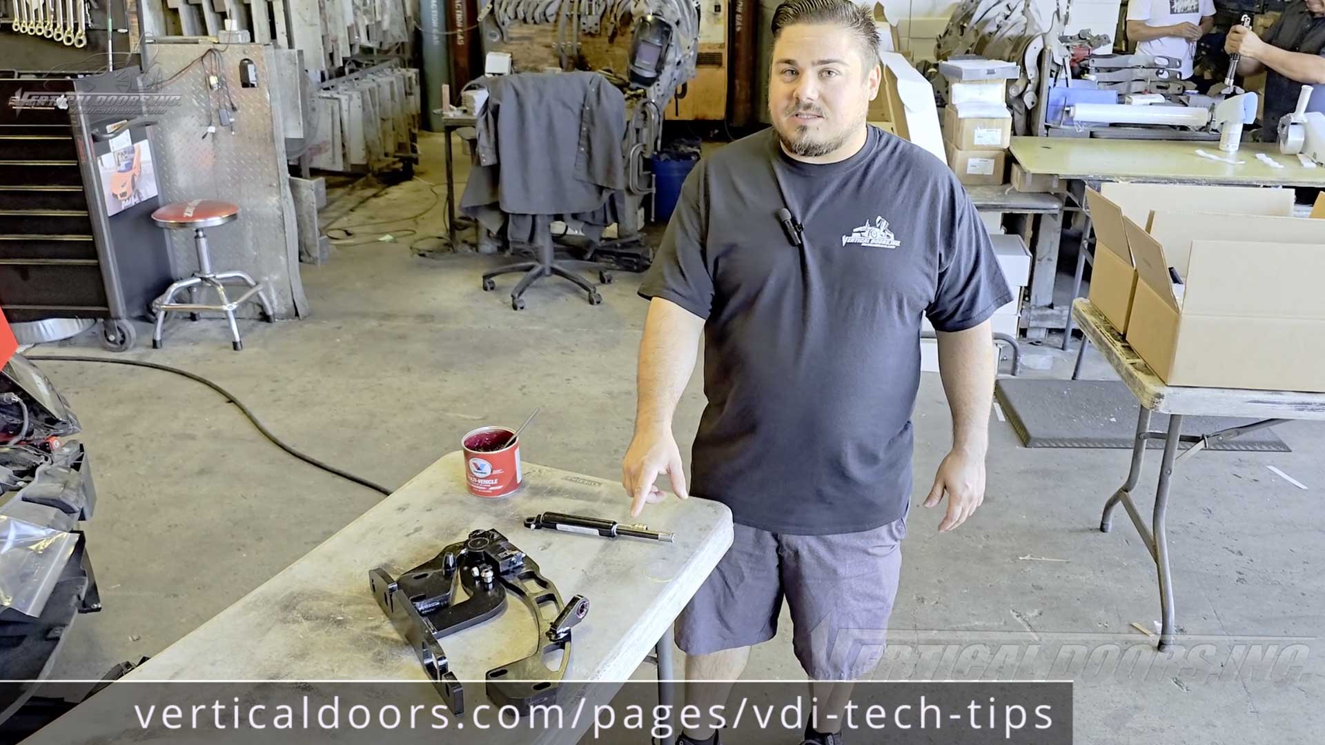 Tech Tip, how to install the Vertical Doors, Inc. shock. Greasing the Spherical Ball Bearing.