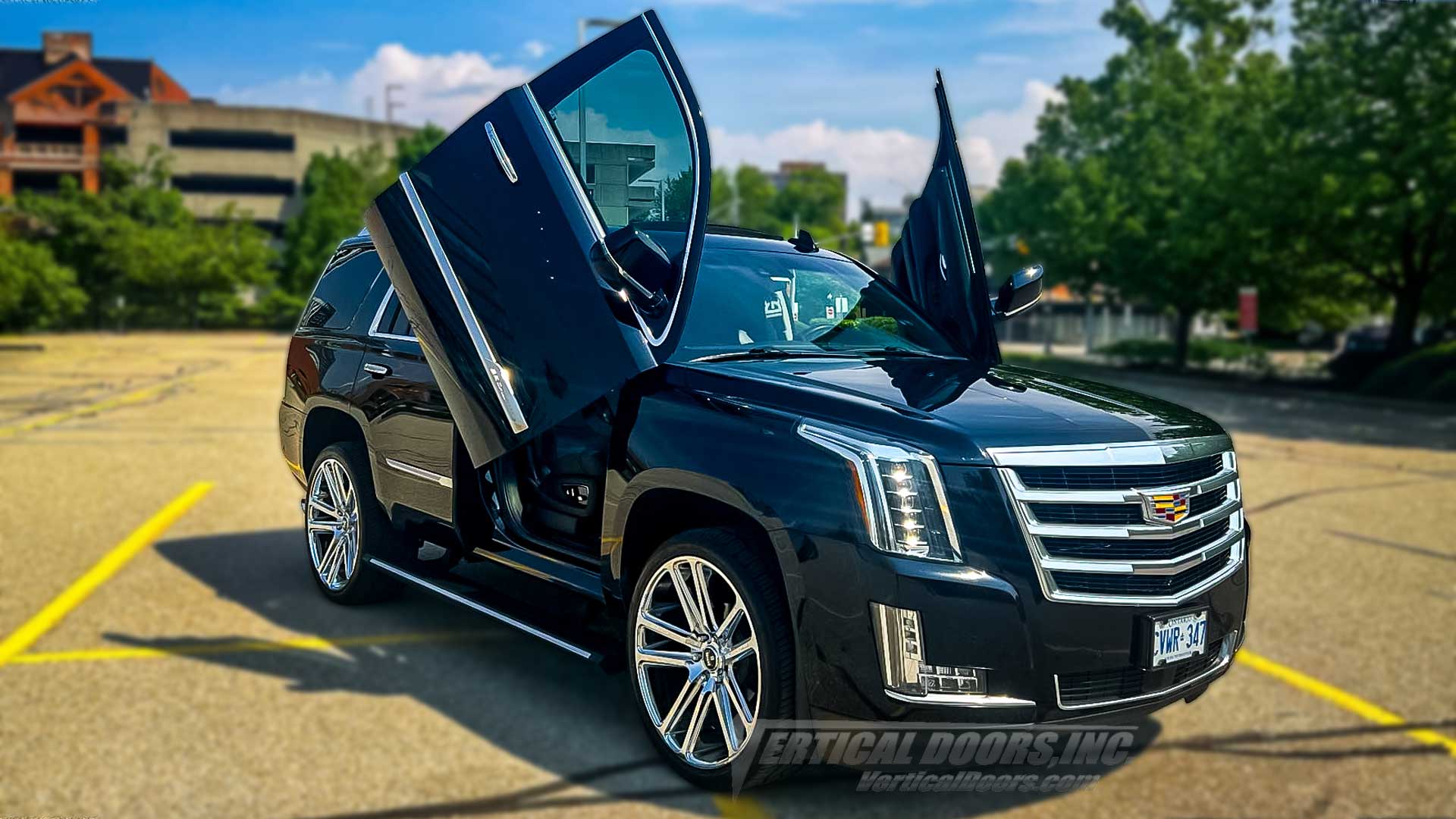 Black 2015–2020 Cadillac Escalade in Ontario Canada featuring Vertical Doors, Inc. VDCCADESC1520 Lambo Door Kit with scissor style vertical door conversion on a luxury SUV