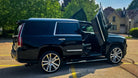 Black Cadillac Escalade ESV 2015–2020 showcasing Vertical Doors, Inc. scissor doors conversion kit VDCCADESC1520 installed in Ontario Canada luxury SUV with vertical opening doors