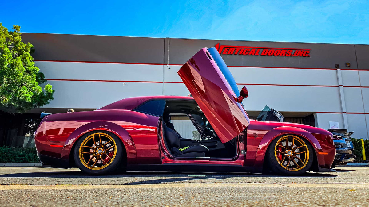 Custom red 2019 Dodge Challenger Hellcat Redeye with vertical doors and gold wheels outside Vertical Doors, Inc.
