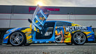 @boricua_bronx27 Charles’ Last Call 23 B5 Blue Dodge Charger with Wolverine graphics, custom wheels, and Vertical Doors, Inc. lambo doors installed at the Lake Elsinore HQ.