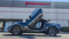 Black Mazda MX5 Miata with Vertical Doors Inc. lambo door hinge conversion kit VDCMAZMX516 outside VDI facility