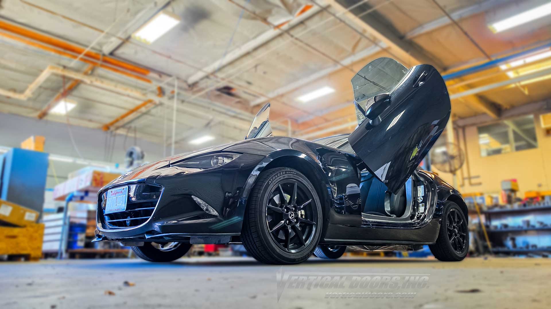 Mazda MX5 Miata lambo doors conversion kit VDCMAZMX516 installed inside the Vertical Doors Inc. shop