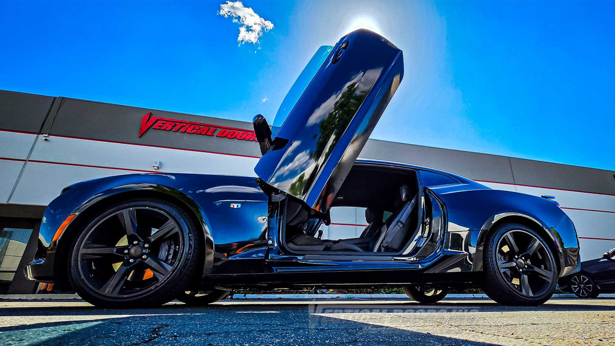 2016-2024 Chevrolet Camaro Vertical Doors, Inc. Lambo Doors installed with Driver's door raised in front of the Lake Elsinore shop 