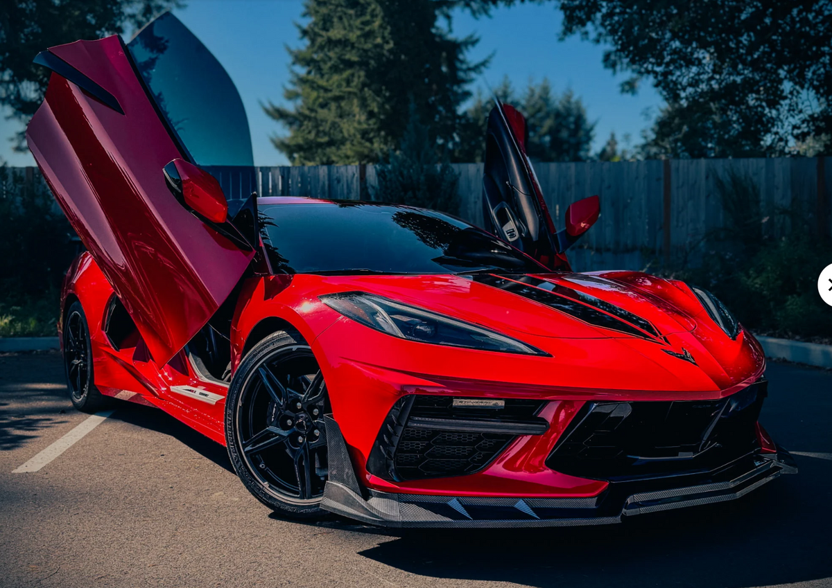 Michaels red Chevrolet Corvette C8 showing off lambo door conversion kit by Vertical Doors, Inc.