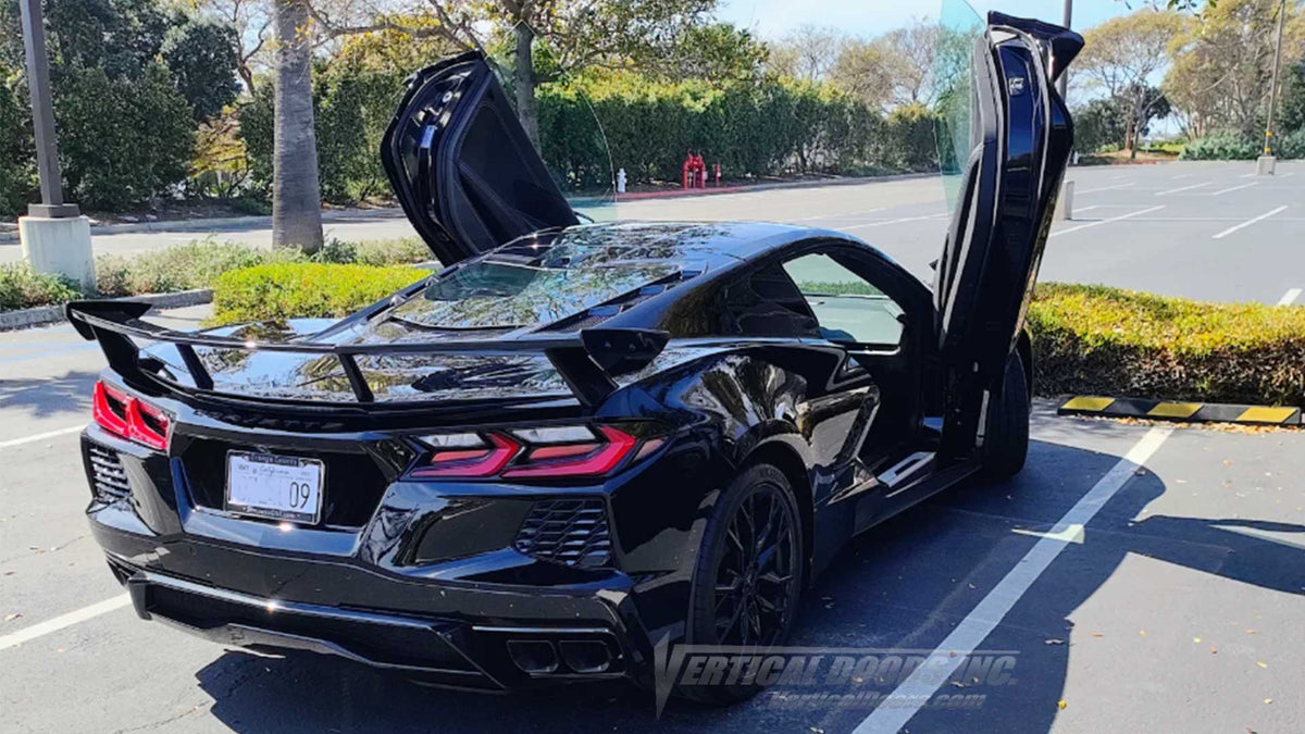 Joe's Black Chevrolet Corvette C8 showing off a vertical door conversion kit installed by the best with the best manufacturer, Vertical Doors, Inc.